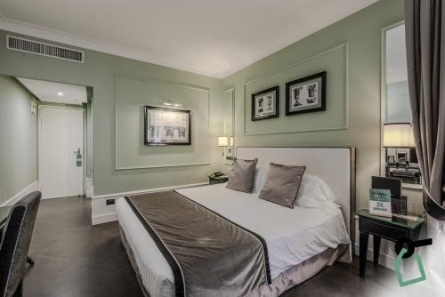 a bedroom with a large bed in a room at HOTIDAY Room Collection - Napoli Diaz in Naples