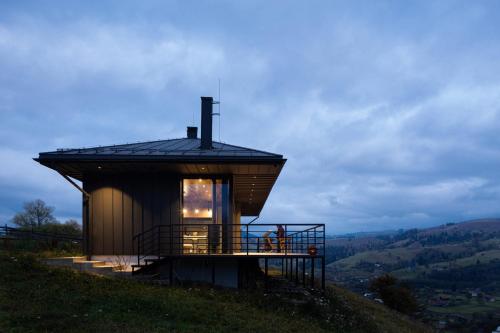 a small house on top of a hill at Krasnyk Resort in Krasnik
