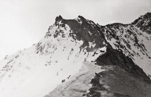 a black and white photo of a snow covered mountain at Gite du pèlerin-Chalet de montagne in Orsières