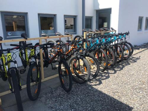 a row of bikes parked next to a building at Agger lejligheder - 100 m fra Vesterhavet in Vestervig