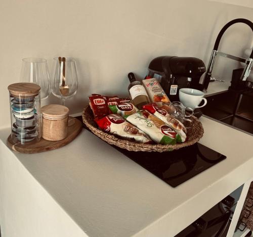 a table with a basket of food on a counter at Vie rêvée luxury suites in Ganema