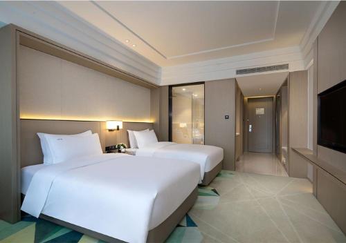 Katil atau katil-katil dalam bilik di Holiday Inn Ningde Dijing by IHG