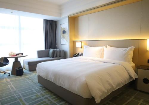 Katil atau katil-katil dalam bilik di Holiday Inn Ningde Dijing by IHG