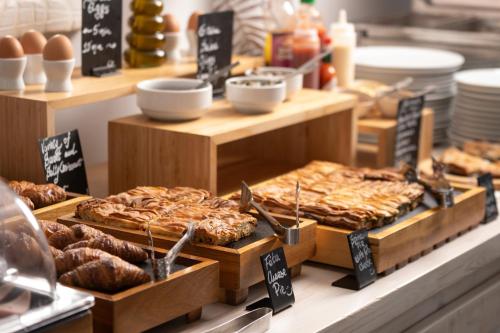 a bakery with various types of pastries on display at Santorini Princess Spa Hotel in Imerovigli