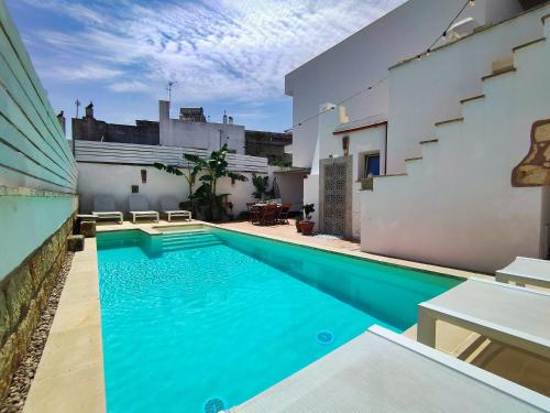 a swimming pool in the backyard of a house at Da Lorenza di Casa Camilla Journey in Depressa