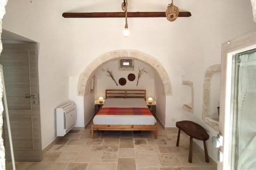 Un ou plusieurs lits dans un hébergement de l'établissement Trullo Mamì