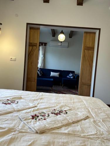 a bedroom with a bed with flowers on it at Saint Johns Hill Boutique Ephesus in Selcuk