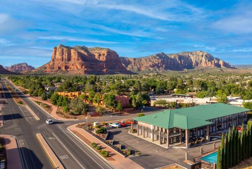an aerial view of a town with mountains in the background at Kokopelli Inn Sedona, Trademark Collection by Wyndham in Sedona