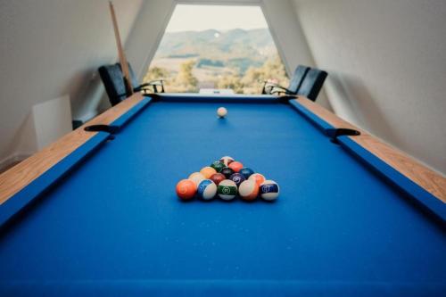 a pool table with balls on top of it at Vila Hasandić in Visoko