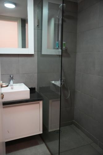 a bathroom with a shower and a sink at B RESIDENCE in Beirut