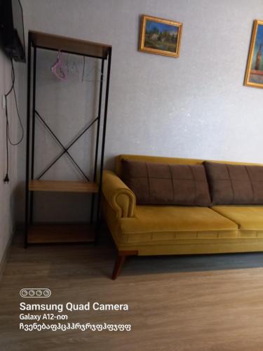 a living room with a couch in a room at Hotel Zaira in Tbilisi City