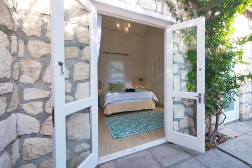 Katil atau katil-katil dalam bilik di Seafever In Arniston