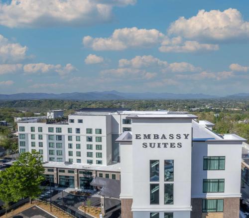 an office building with the embassy suites sign on it at Embassy Suites By Hilton Asheville Downtown in Asheville
