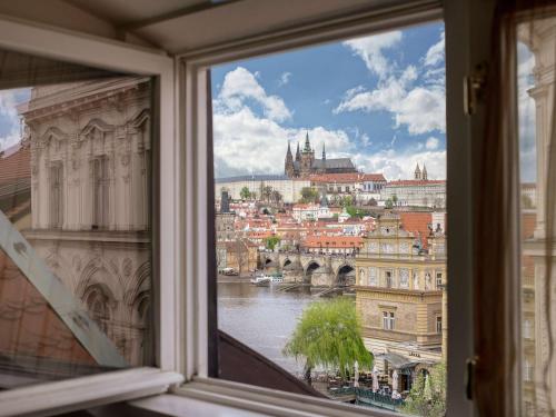 a view of a city from a window at The Mozart Prague in Prague