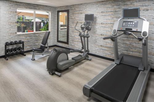 a gym with tread machines and a treadmill at Residence Inn Orlando Convention Center in Orlando