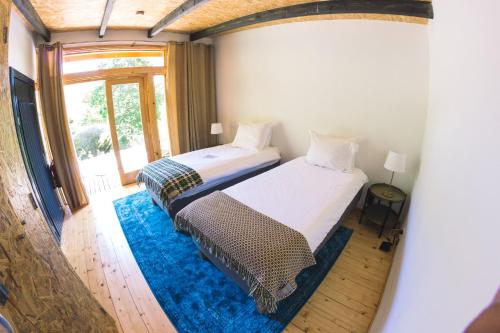 Ένα ή περισσότερα κρεβάτια σε δωμάτιο στο D'Alijo Retreat Center