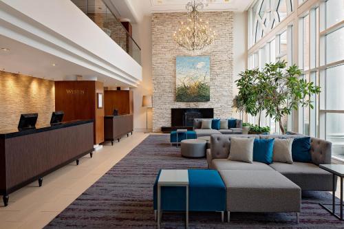 a lobby with couches and a fireplace at The Westin Governor Morris, Morristown in Morristown