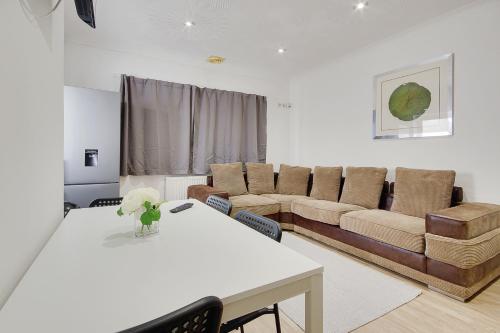 a living room with a couch and a table at Serenity Hotel in Bournemouth