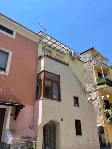 a building with a balcony on top of it at Casa Carrafa in Nocera Inferiore
