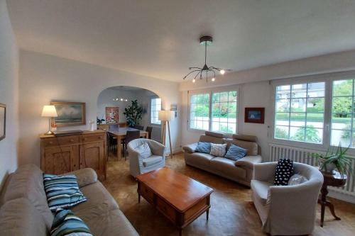 a living room with a couch and a table at Beautiful family house in Meucon in Meucon