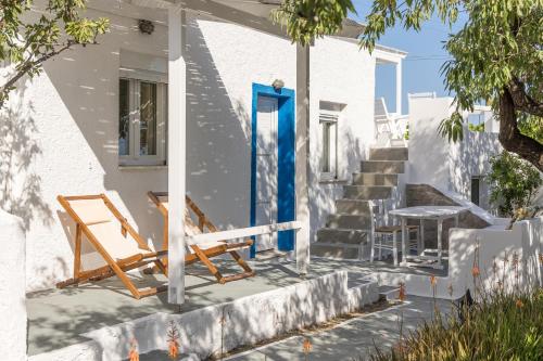 two chairs and a table on the side of a house at Summer Residence in Provatas