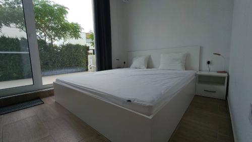Postel nebo postele na pokoji v ubytování Brisa Apartment