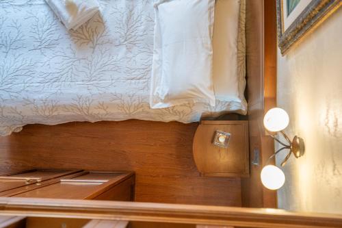 Letto o letti in una camera di Art Hotel Santa Lucia