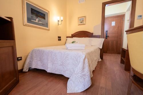 Letto o letti in una camera di Art Hotel Santa Lucia