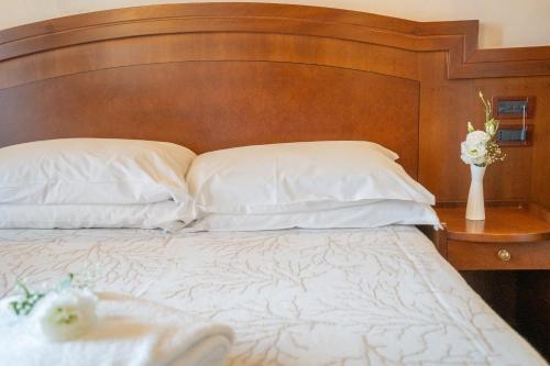 Letto o letti in una camera di Art Hotel Santa Lucia