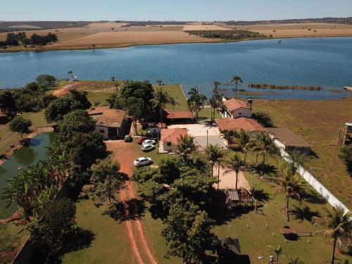 an aerial view of a house next to a lake at Pontal da lagoa in Planaltina
