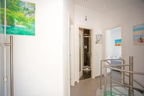 a room with a staircase and a bathroom at N&L VILLAS in Pyrgi