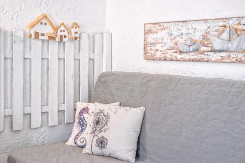 a living room with a couch and a white radiator at Brunis Apartments in Nei Poroi