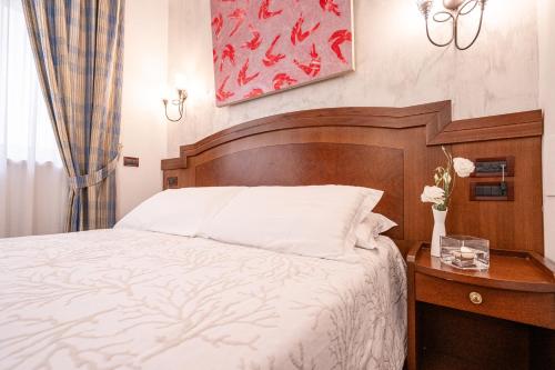 Letto o letti in una camera di Art Hotel Santa Lucia