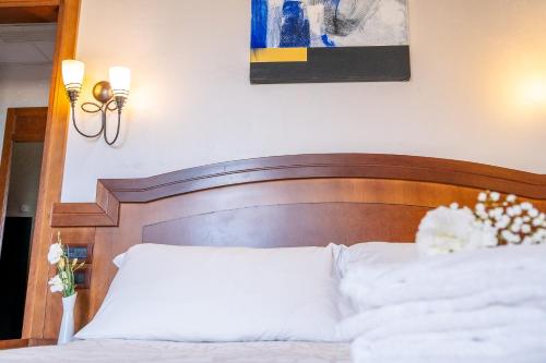 Letto o letti in una camera di Art Hotel Santa Lucia