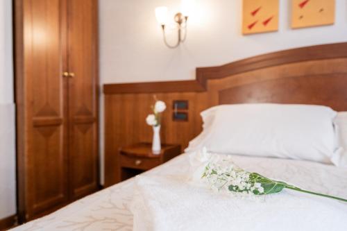 Letto o letti in una camera di Art Hotel Santa Lucia
