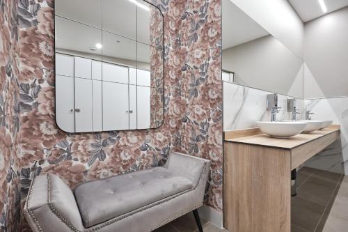 a bathroom with a sink and a mirror at Hotel San Lorenzo in Santiago de Compostela