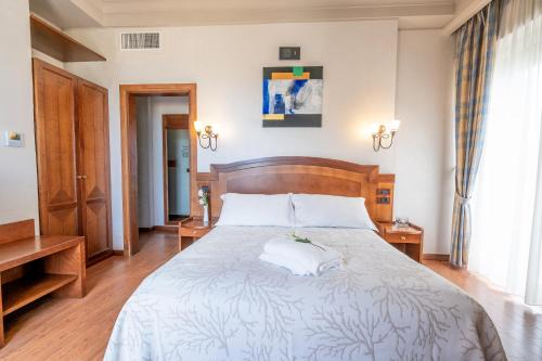 Letto o letti in una camera di Art Hotel Santa Lucia