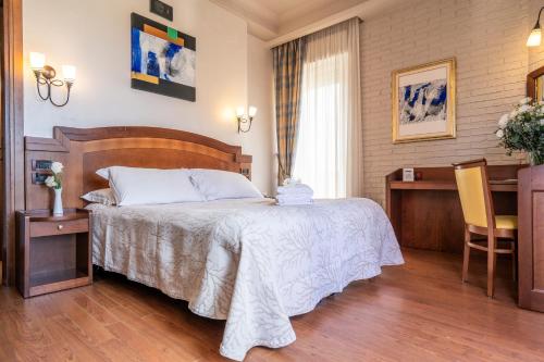 Letto o letti in una camera di Art Hotel Santa Lucia