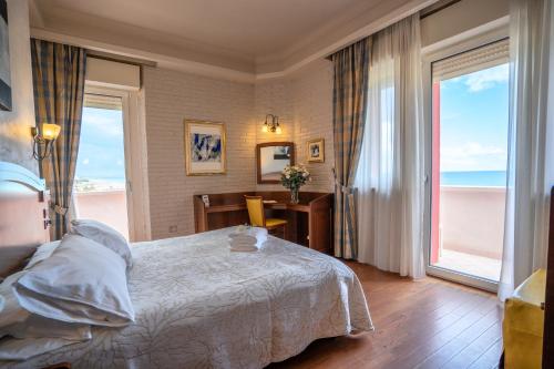 Letto o letti in una camera di Art Hotel Santa Lucia