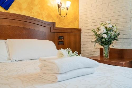 Letto o letti in una camera di Art Hotel Santa Lucia