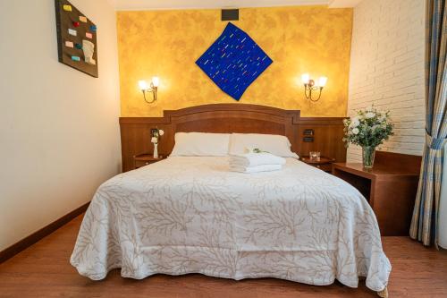 Letto o letti in una camera di Art Hotel Santa Lucia