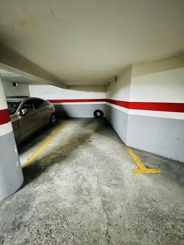 a parking garage with a car parked in it at A Orillas del Pilar con parking in Zaragoza
