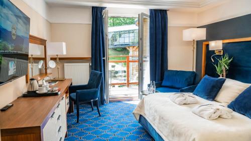 Posteľ alebo postele v izbe v ubytovaní Hotel Czarny Potok Resort SPA & Conference