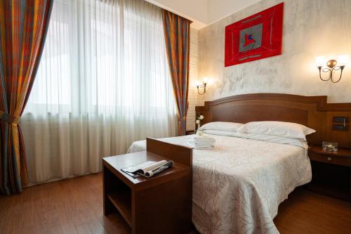 Letto o letti in una camera di Art Hotel Santa Lucia