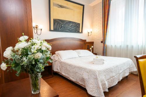 Letto o letti in una camera di Art Hotel Santa Lucia
