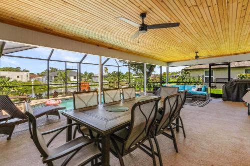 a dining room with a table and chairs at Cozy Retreat, heated pool, water canal, bikes,3 bedroom in Cape Coral