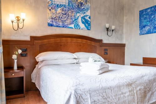 Letto o letti in una camera di Art Hotel Santa Lucia