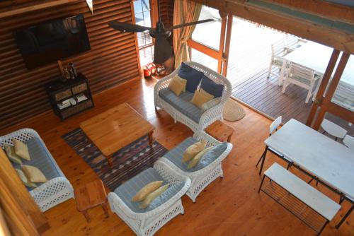 an overhead view of a living room with a table and chairs at House 52 in Sodwana Bay