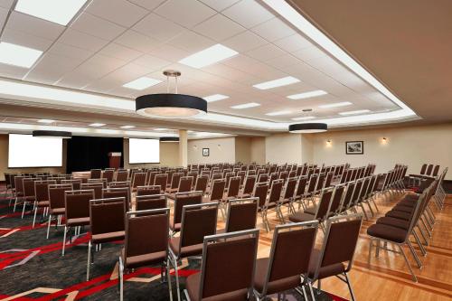 a large room with rows of chairs in it at Four Points by Sheraton Edmonton South in Edmonton