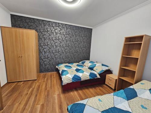 Postel nebo postele na pokoji v ubytování Mantra Wellness Apartments